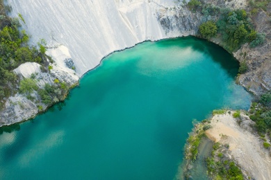 Beautiful turquoise lake with granite banks, aerial view