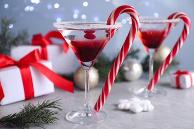 Delicious Christmas cocktail with liqueur on grey table