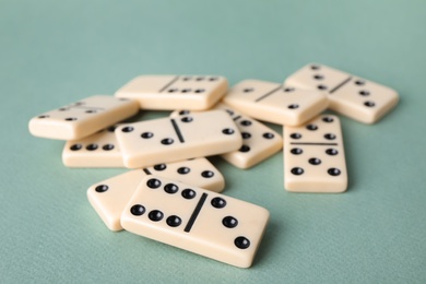 Pile of domino tiles on grey background