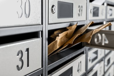 Open mailbox with keyhole, number and envelopes, closeup