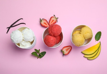 Different delicious ice creams on pink background, flat lay