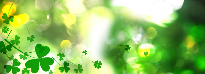 Beautiful clover leaves on blurred green background. St Patrick's day