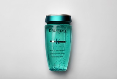 MYKOLAIV, UKRAINE - SEPTEMBER 07, 2021: Kerastase shampoo on light background, top view. Hair care cosmetic product