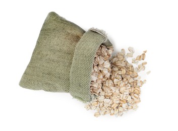 Raw oatmeal and sack bag on white background, top view