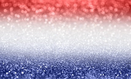 4th of July - USA Independence  Day. Blurred view of glitters in colors of American national flag, bokeh effect 