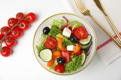 Tasty fresh Greek salad on white background, top view