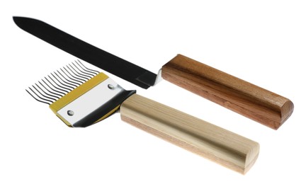 Uncapping fork and knife on white background. Beekeeping tools