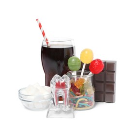 Tooth model with unhealthy food and drink on white background