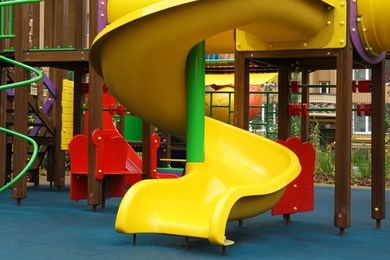 Colourful slide on outdoor playground for children in residential area