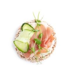 Crunchy buckwheat cakes with cream cheese, prosciutto and cucumber slice isolated on white, top view