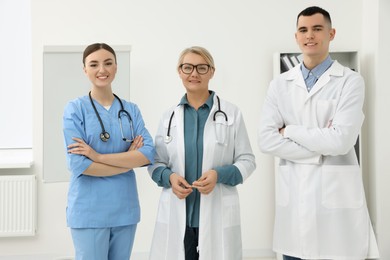 Photo of Portrait of medical doctors wearing uniforms in clinic