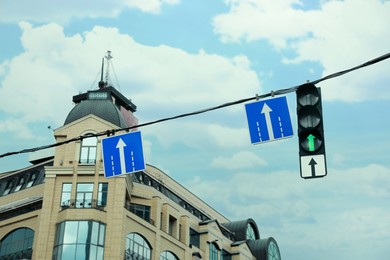 City street with traffic lights and road signs