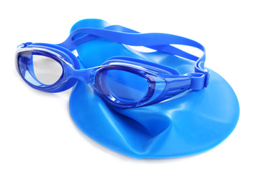 Swim goggles and cap isolated on white. Beach objects