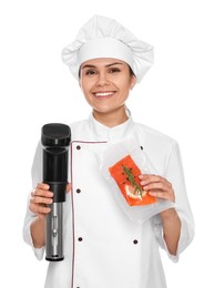 Chef holding sous vide cooker and salmon in vacuum pack on white background