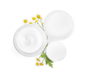 Body cream and other cosmetic products with camomile on white background, top view