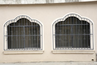 Photo of Building with beautiful windows and steel grilles