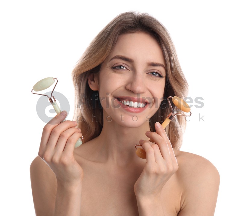 Photo of Young woman with natural face rollers on white background