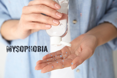 Woman applying antiseptic gel on hand, closeup. Mysophobia