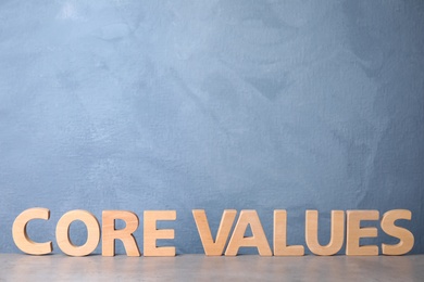 Photo of Phrase CORE VALUES made of wooden letters on light table