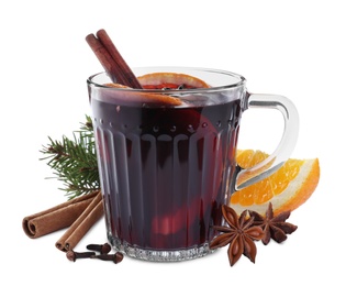 Aromatic mulled wine and ingredients on white background