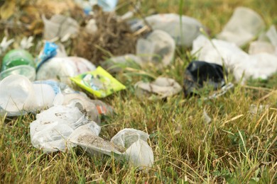 Garbage scattered on grass. Environment pollution problem