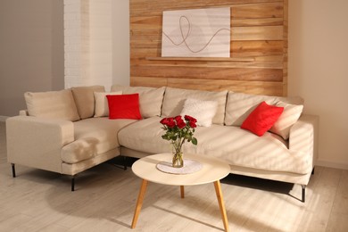 Modern comfortable sofa near wall in room. Interior design
