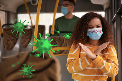 African-American woman wearing medical mask in bus. Virus protection