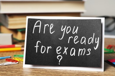 Card with question Are You Ready For Exams? on wooden table