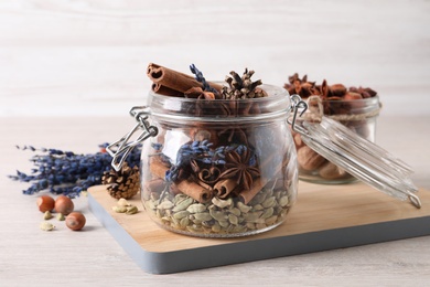 Aroma potpourri with different spices on white wooden table