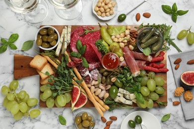 Photo of Set of different delicious appetizers served on white marble table, flat lay