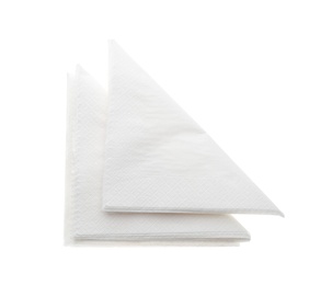 Folded clean paper tissues on white background, top view