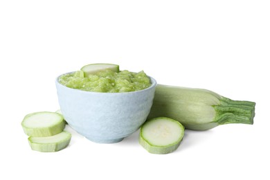 Delicious vegetable puree and fresh zucchini on white background. Healthy food