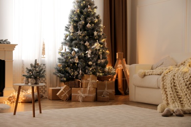 Beautiful living room interior with decorated Christmas tree and gifts