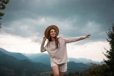 Young woman enjoying her time in mountains