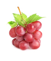 Bunch of red grapes with green leaves isolated on white
