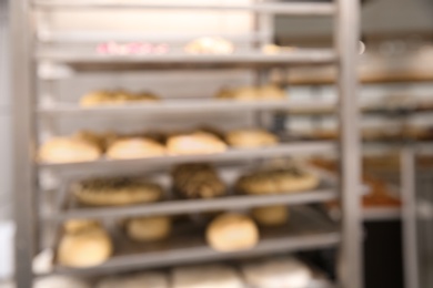 Blurred view of rack with pastries in workshop