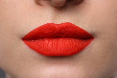 Young woman with beautiful red lips, closeup