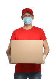 Courier in protective mask and gloves holding cardboard box on white background. Delivery service during coronavirus quarantine