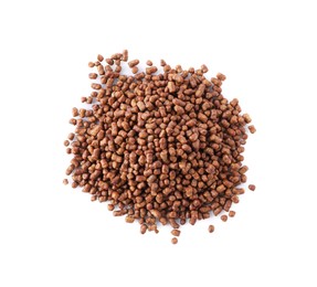Pile of buckwheat tea granules on white background, top view