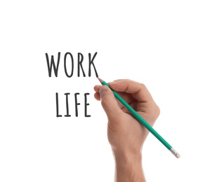 Work-life balance concept. Man with pencil and words on white background, closeup