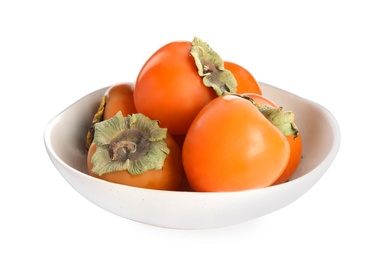 Bowl with delicious persimmons isolated on white