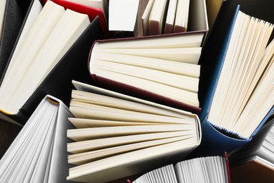 Photo of Many hardcover books as background, top view