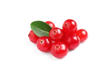 Pile of fresh cranberries with green leaf on white background