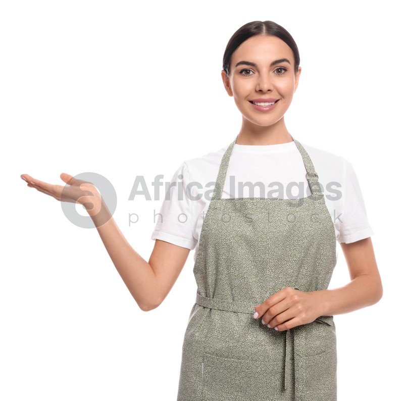 Young woman in light green apron on white background
