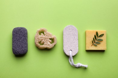 Flat lay composition with pumice stones on light green background