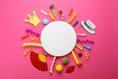 Flat lay composition with carnival items and blank card on pink background. Space for text