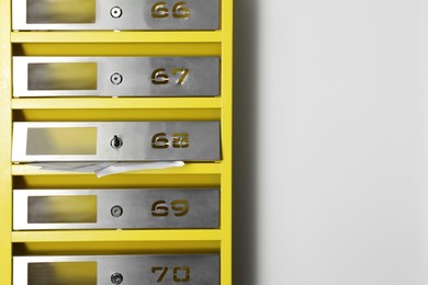 Metal mailboxes with keyholes, numbers and receipts in post office, space for text