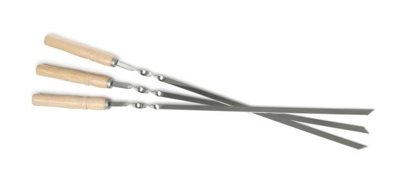 Metal skewers with wooden handle on white background, top view