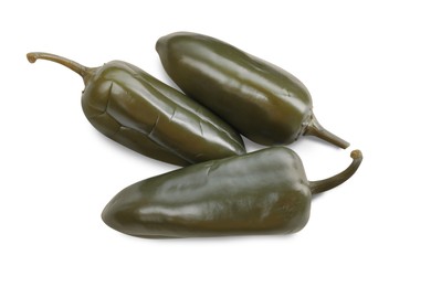 Photo of Pickled green jalapeno peppers on white background, top view