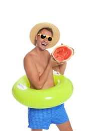 Shirtless man with inflatable ring and watermelon on white background